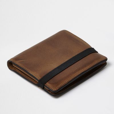 Tan leather foldout wallet